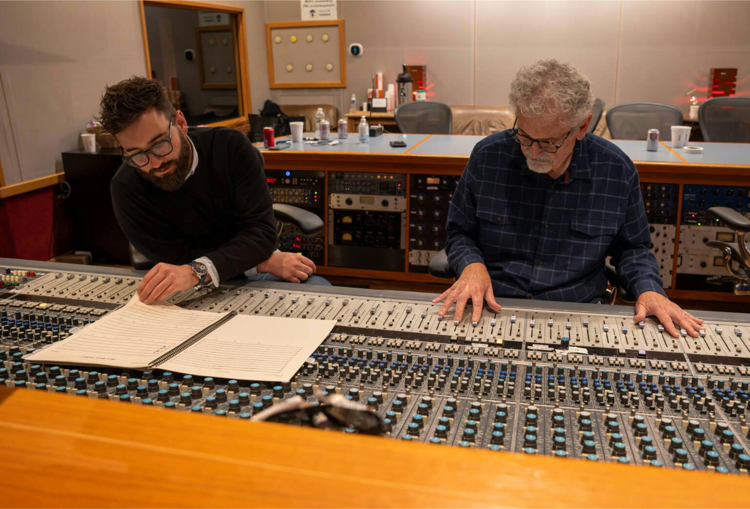 Oliver and his father, Bill, running the soundboard during a recording session.