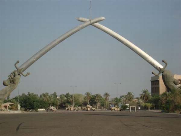 American Humvee's, like the ones Michael Sampson rode in, are shown underneath the Swords of Qādisīyah, better known as the Victory Arch in Baghdad, Iraq.